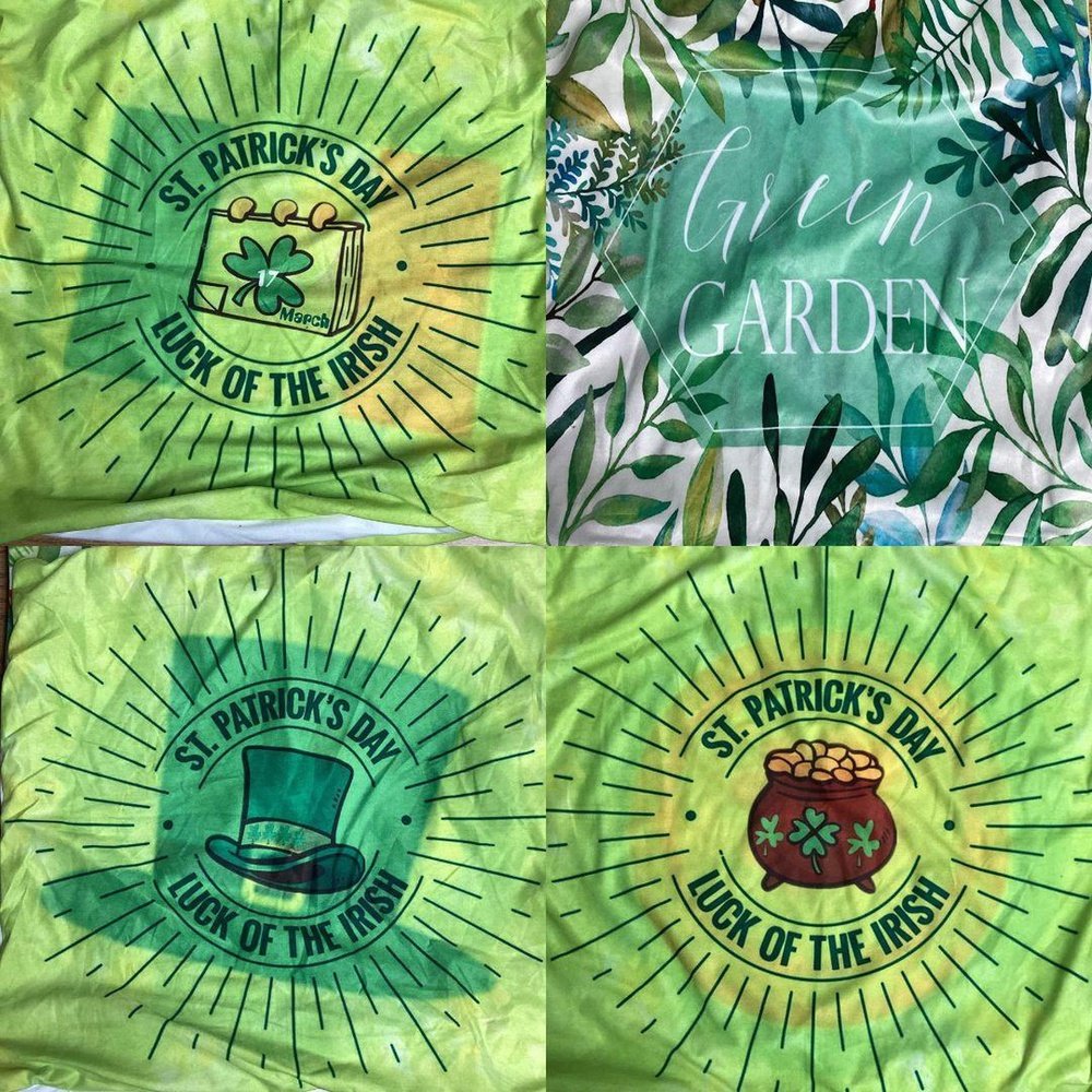 a green tie - dye shirt with a shamrock and a hat on it