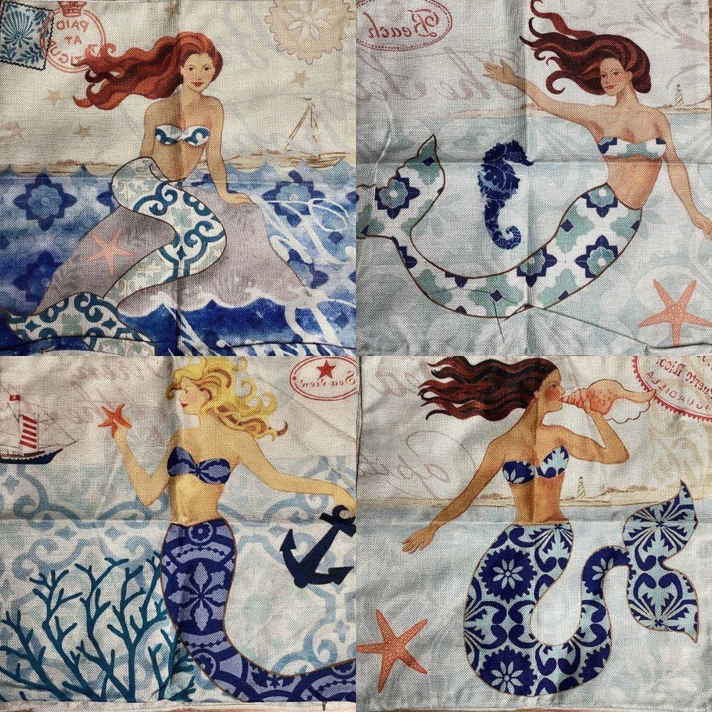 a piece of fabric with mermaids on it