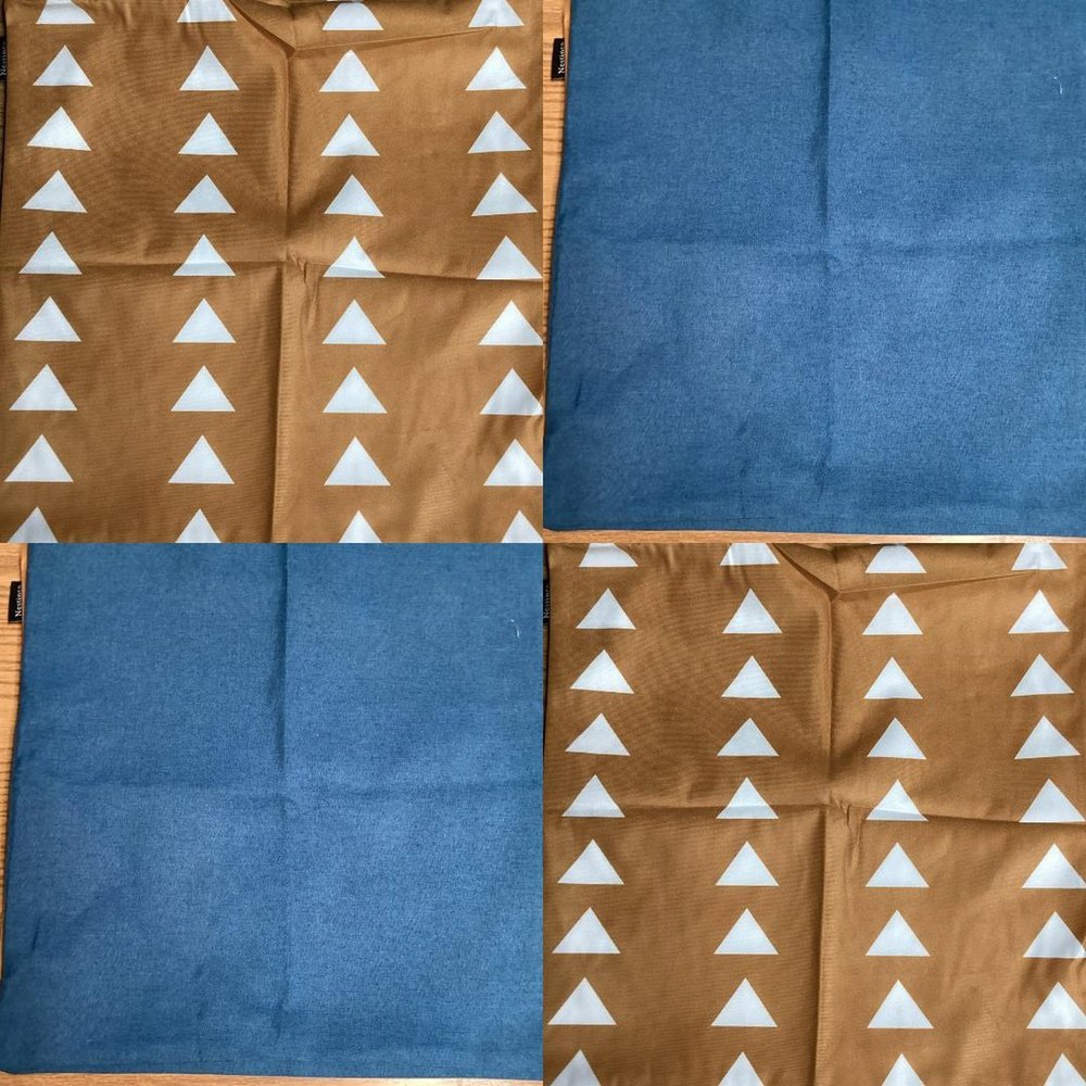 a piece of cloth with white triangles on it