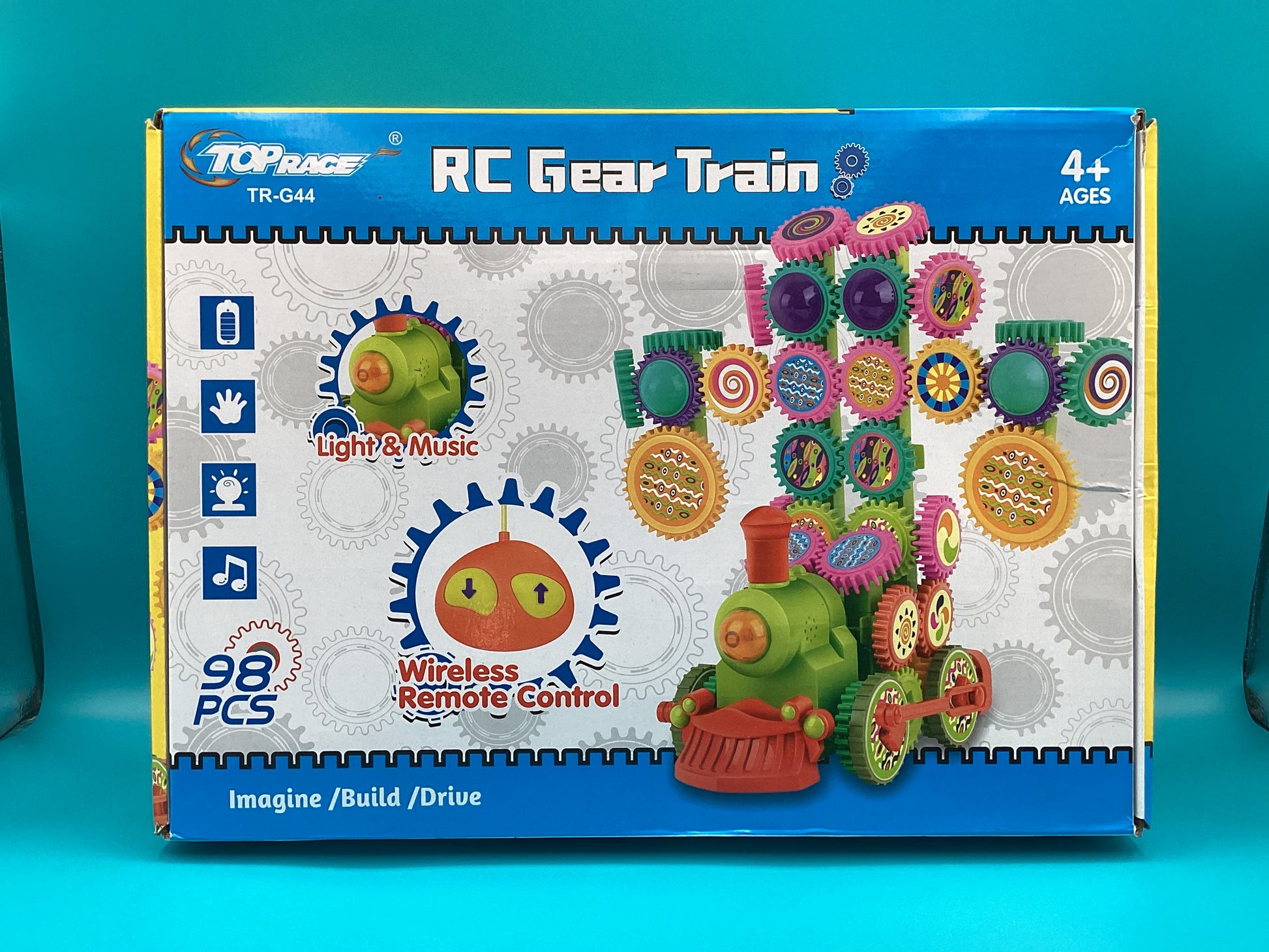 a box of plastic gears on a blue background