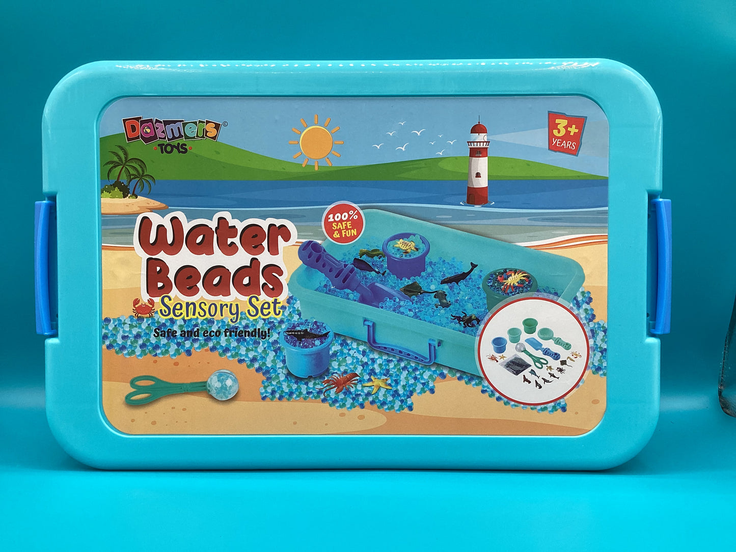 a blue lunch box with a picture of a beach scene