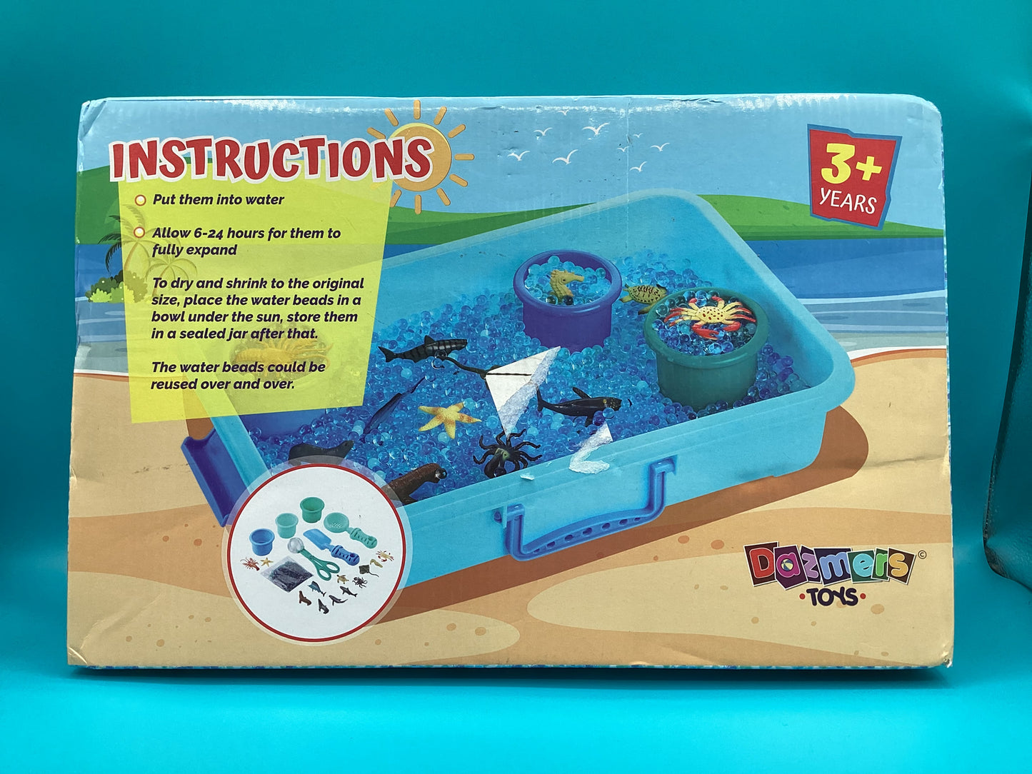 a box with a picture of a beach scene inside of it