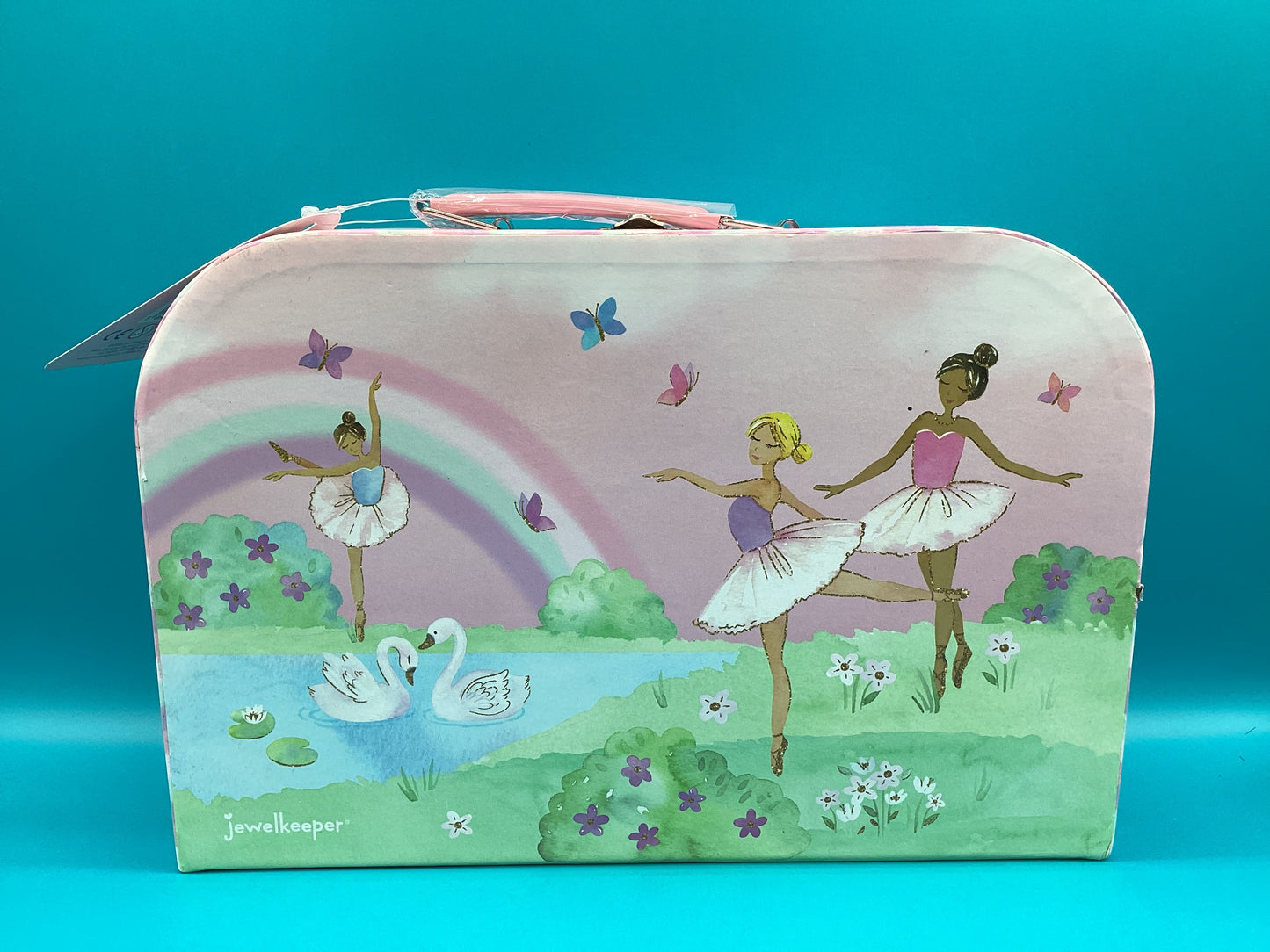 a suitcase with a painting of two ballerinas on it