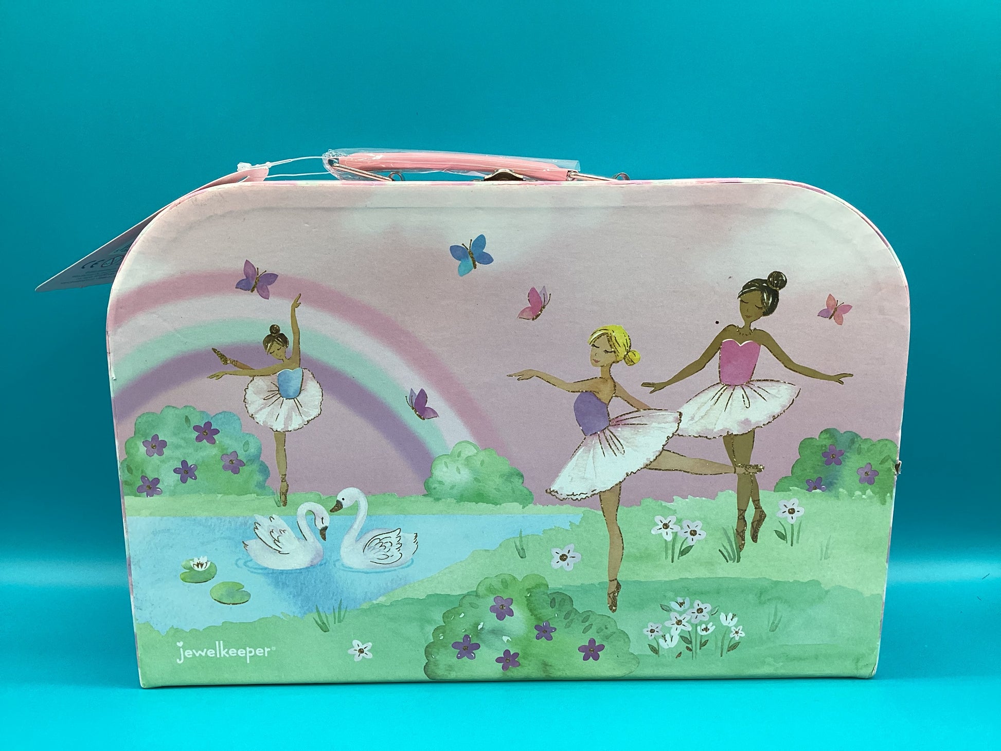 a suitcase with a painting of two ballerinas on it