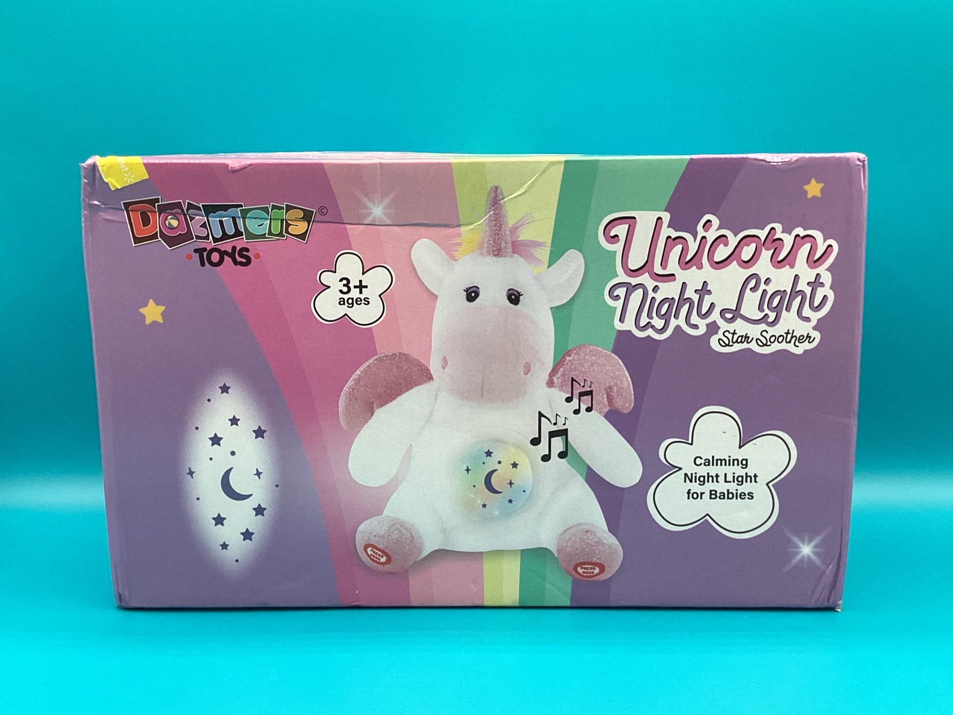 a unicorn light up toy sitting in a box