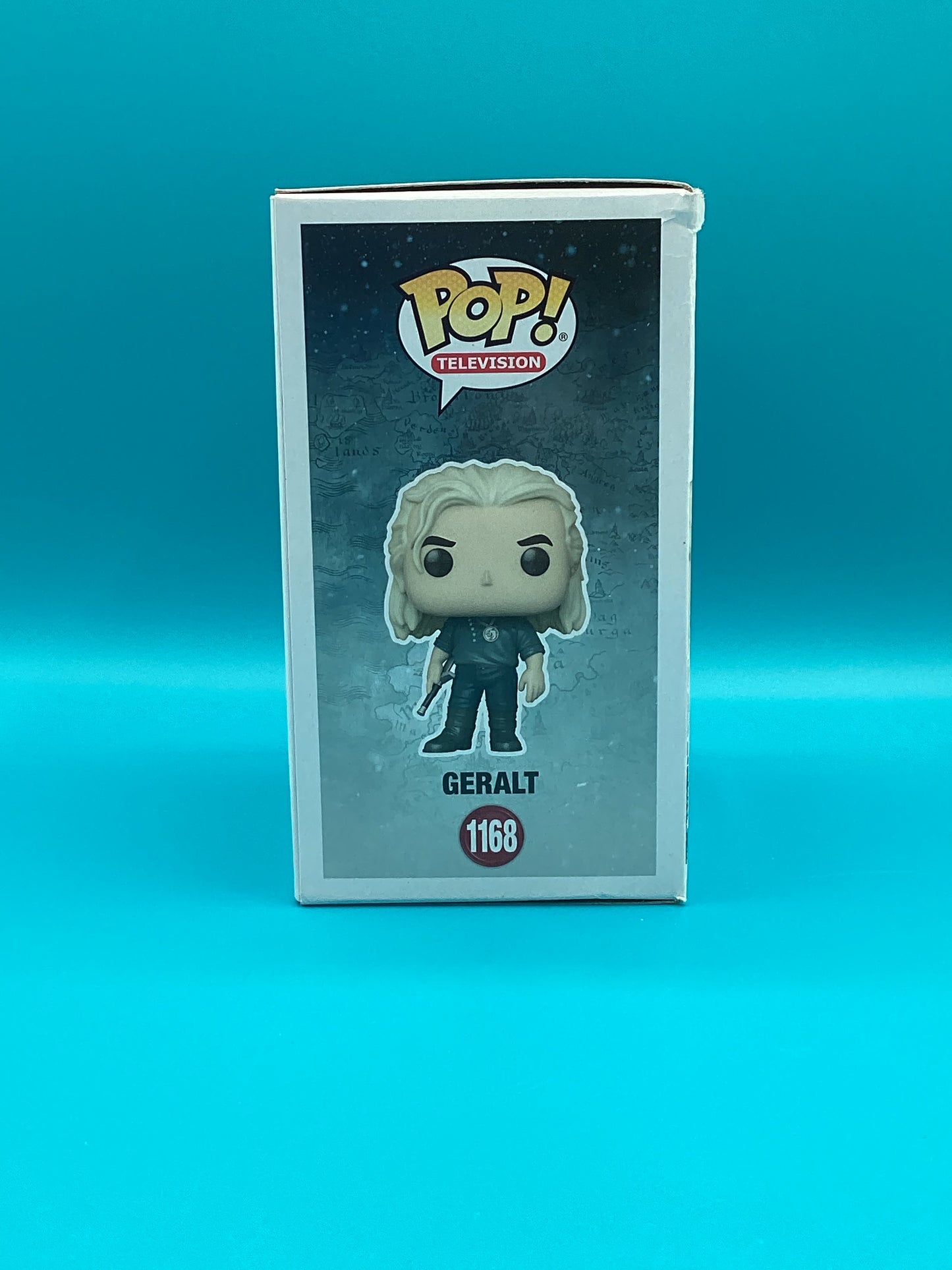 a pop vinyl figure in a box on a blue background